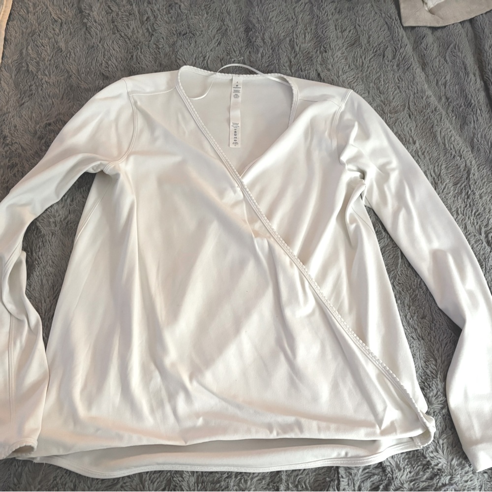 Lululemon white long sleeve top. Cross wrap front. Excellent condition